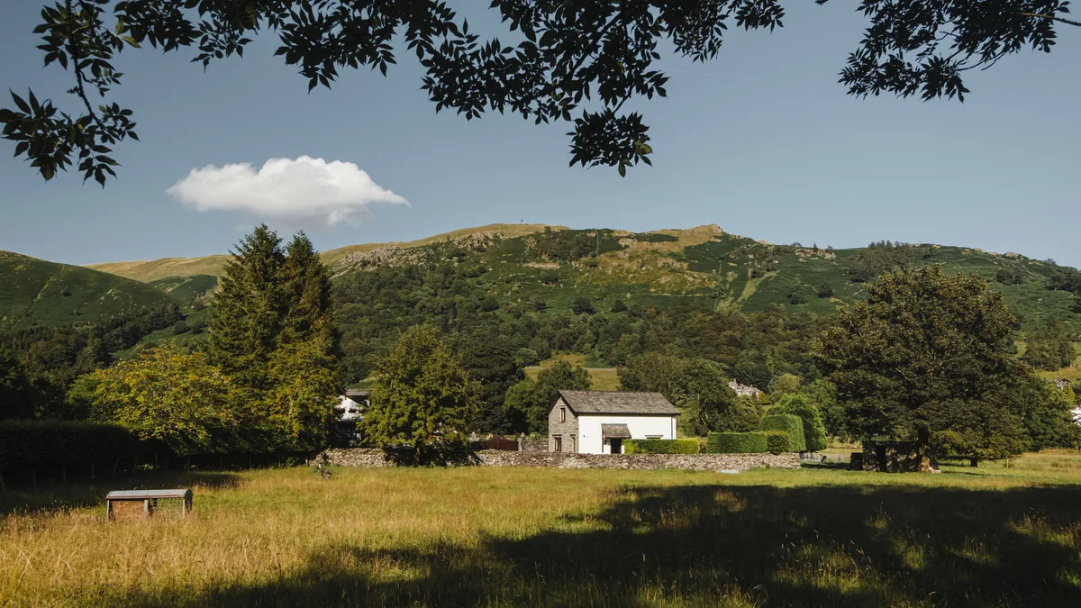 Private water source building in a rural landscape
