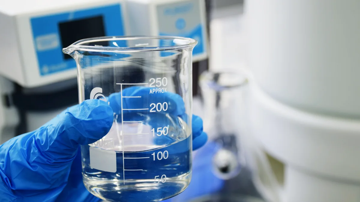 Laboratory water sample being checked for water quality